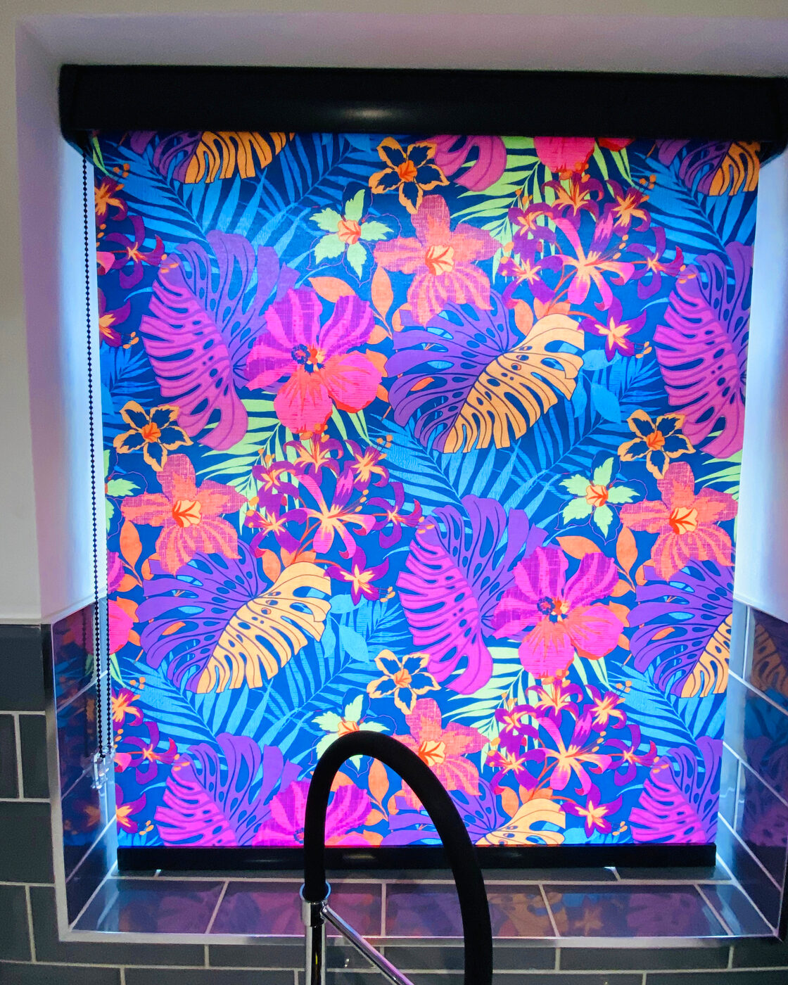 Neon tropical roller blind in a modern kitchen fitted by Blinds 4 U